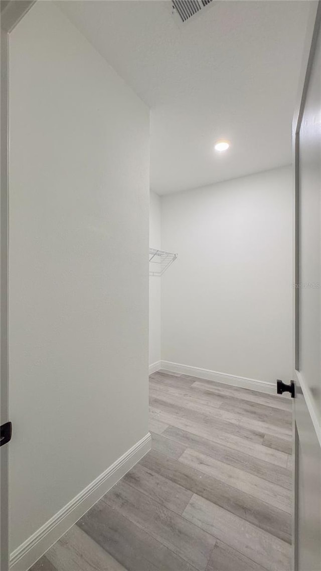 2486 W Magenta Dr, Citrus Springs, FL 34434 - spacious closet featuring wood finished floors