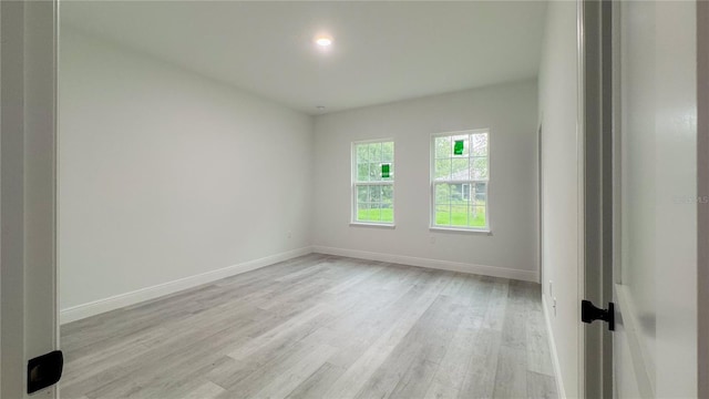 2486 W Magenta Dr, Citrus Springs, FL 34434 - empty room with light wood-type flooring and baseboards