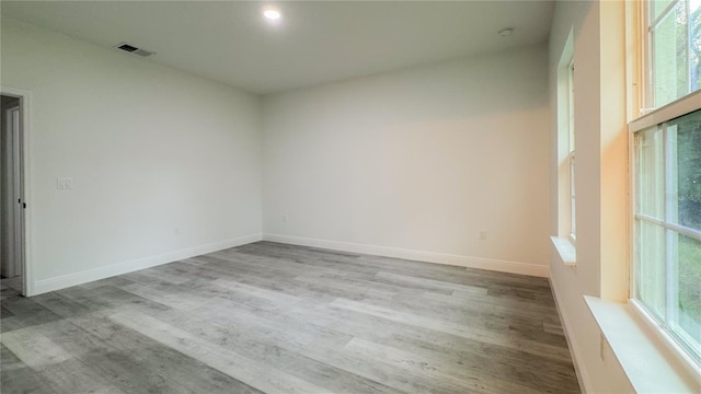 2486 W Magenta Dr, Citrus Springs, FL 34434 - empty room featuring wood finished floors and baseboards