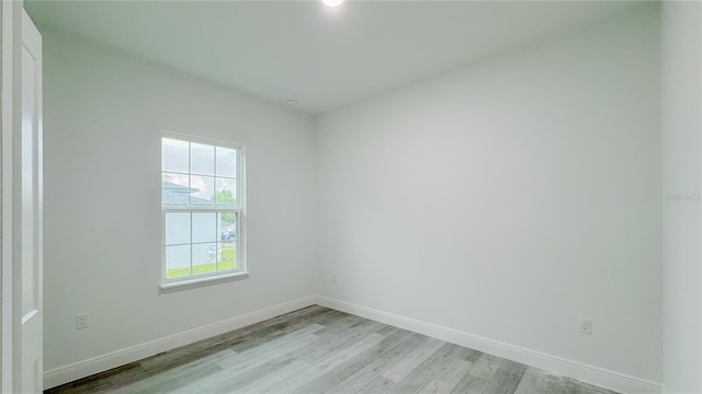 2486 W Magenta Dr, Citrus Springs, FL 34434 - unfurnished room featuring light wood-type flooring and baseboards