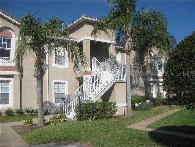 2826 Osprey Cove Pl Unit 103, Kissimmee, FL 34746 - view of building exterior featuring stairs