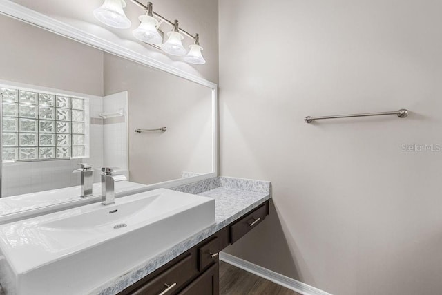 2825 NW 104th Ct Unit B, Gainesville, FL 32606 - full bathroom featuring vanity, wood finished floors, and a shower