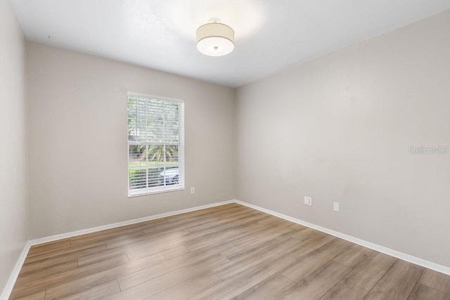 2825 NW 104th Ct Unit B, Gainesville, FL 32606 - unfurnished room featuring wood finished floors and baseboards