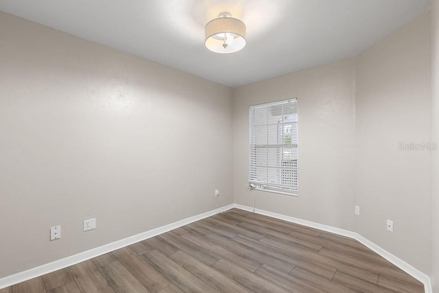 2825 NW 104th Ct Unit B, Gainesville, FL 32606 - spare room with wood finished floors and baseboards