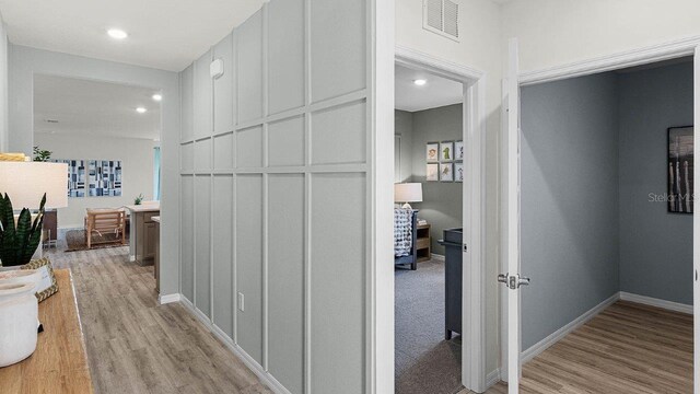 3585 Roden Rd, Haines City, FL 33844 - hall with light wood-type flooring, recessed lighting, and baseboards