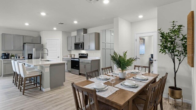 3585 Roden Rd, Haines City, FL 33844 - dining space with light wood-style floors, baseboards, and recessed lighting
