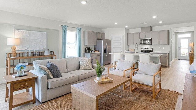 3585 Roden Rd, Haines City, FL 33844 - living area with light wood-style flooring and recessed lighting