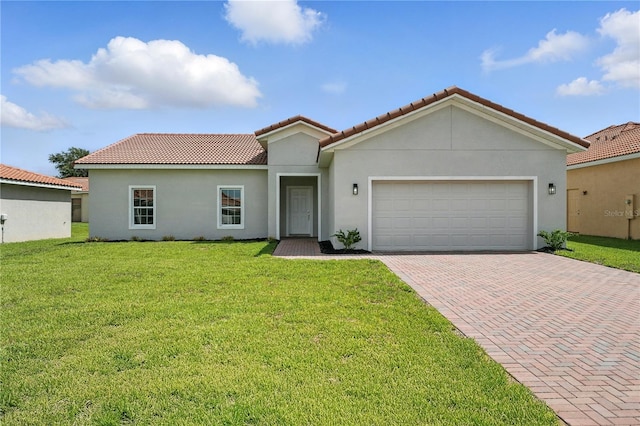 436 Caraway Dr, Kissimmee, FL 34759 - mediterranean / spanish house with decorative driveway, a tile roof, stucco siding, and a front yard