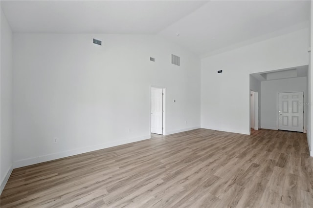436 Caraway Dr, Kissimmee, FL 34759 - unfurnished room featuring high vaulted ceiling and light wood-style floors