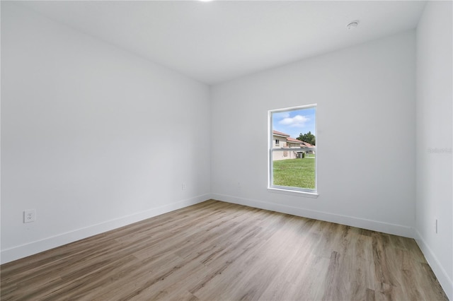 436 Caraway Dr, Kissimmee, FL 34759 - empty room featuring wood finished floors and a smoke detector