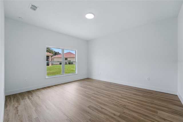 436 Caraway Dr, Kissimmee, FL 34759 - spare room with wood finished floors and baseboards
