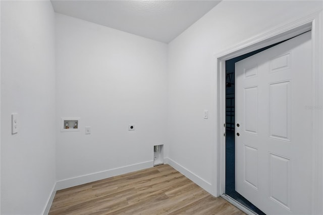 436 Caraway Dr, Kissimmee, FL 34759 - laundry area with hookup for an electric dryer, hookup for a washing machine, and light wood-type flooring