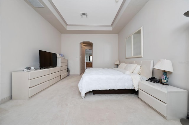 8108 Via Bella Notte, Orlando, FL 32836 - bedroom featuring arched walkways, light carpet, and a raised ceiling