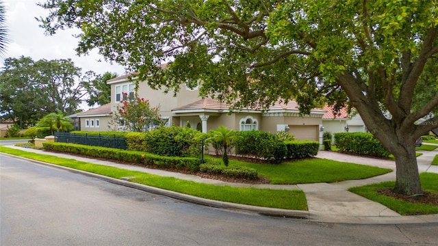8108 Via Bella Notte, Orlando, FL 32836 - obstructed view of property with driveway, a garage, and stucco siding