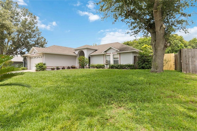 176 Hidden View Dr, Groveland, FL 34736 - ranch-style home featuring a garage and stucco siding