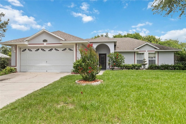 176 Hidden View Dr, Groveland, FL 34736 - ranch-style house with driveway, a front yard, stucco siding, and an attached garage