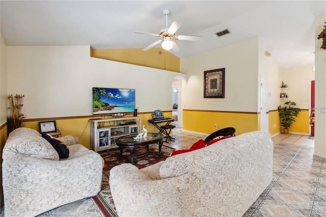 176 Hidden View Dr, Groveland, FL 34736 - tiled living area featuring lofted ceiling, a ceiling fan, arched walkways, and baseboards