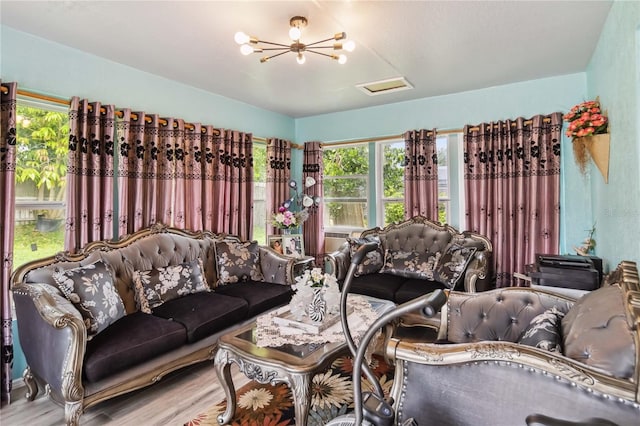 176 Hidden View Dr, Groveland, FL 34736 - living area featuring wood finished floors and attic access