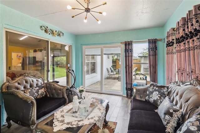 176 Hidden View Dr, Groveland, FL 34736 - living area featuring a chandelier and wood finished floors