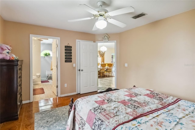 176 Hidden View Dr, Groveland, FL 34736 - bedroom featuring tile patterned flooring, a ceiling fan, baseboards, and ensuite bathroom