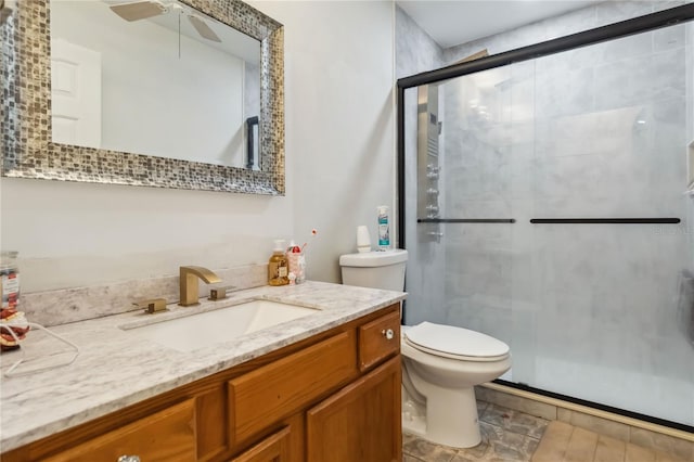 176 Hidden View Dr, Groveland, FL 34736 - full bathroom with a shower stall, vanity, toilet, and ceiling fan