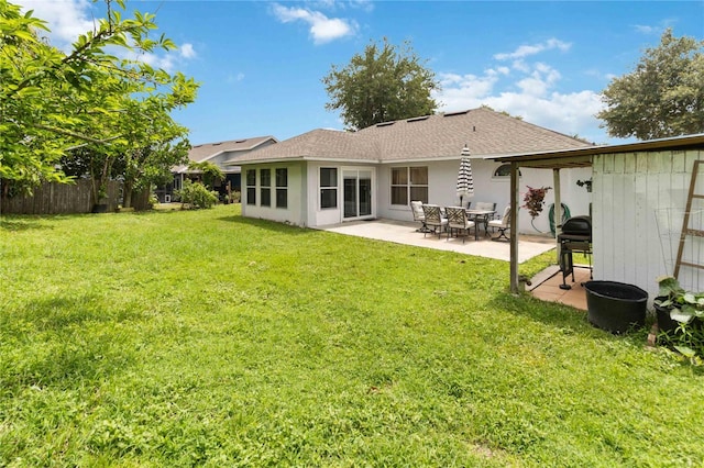 176 Hidden View Dr, Groveland, FL 34736 - back of house with a patio area and a shingled roof