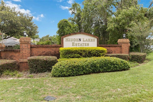 176 Hidden View Dr, Groveland, FL 34736 - community sign featuring a lawn