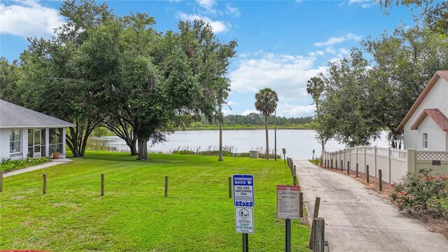 176 Hidden View Dr, Groveland, FL 34736 - surrounding community featuring a water view and a yard