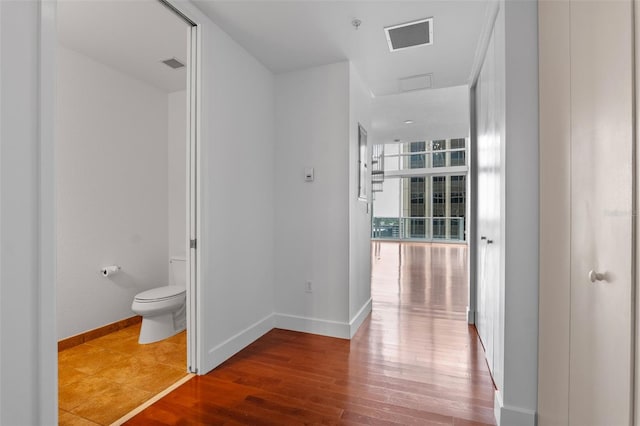 150 E Robinson St Unit 1023, Orlando, FL 32801 - corridor with wood finished floors and attic access