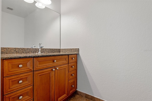 150 E Robinson St Unit 1023, Orlando, FL 32801 - bathroom featuring vanity and tile patterned flooring
