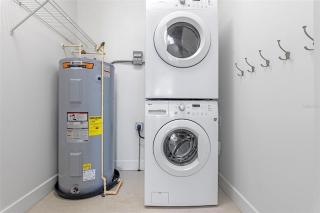150 E Robinson St Unit 1023, Orlando, FL 32801 - laundry area with electric water heater and stacked washer / drying machine