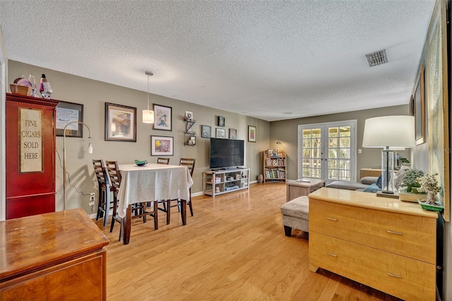 210 Magnolia Rd Unit 214, Maitland, FL 32751 - living area with a textured ceiling and light wood finished floors