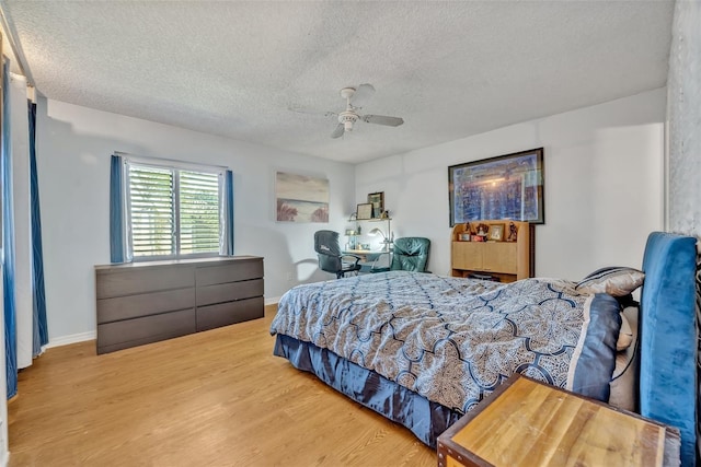 210 Magnolia Rd Unit 214, Maitland, FL 32751 - bedroom with a textured ceiling, wood finished floors, and a ceiling fan
