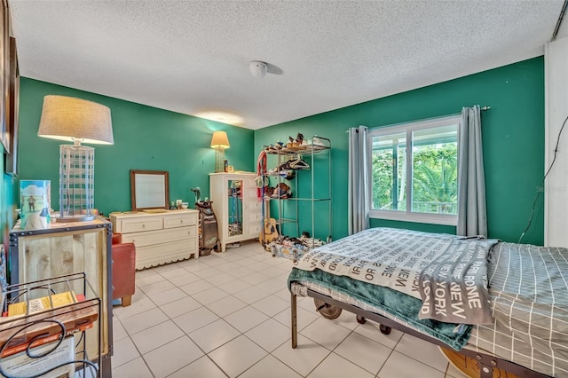 210 Magnolia Rd Unit 214, Maitland, FL 32751 - tiled bedroom with a textured ceiling