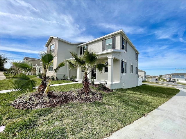 15579 Water Spring Blvd, Winter Garden, FL 34787 - view of side of property featuring stucco siding and a lawn