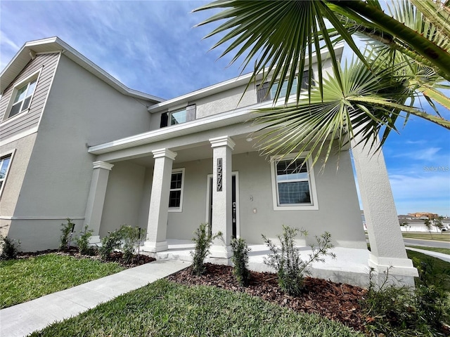 15579 Water Spring Blvd, Winter Garden, FL 34787 - view of front of home with covered porch and stucco siding