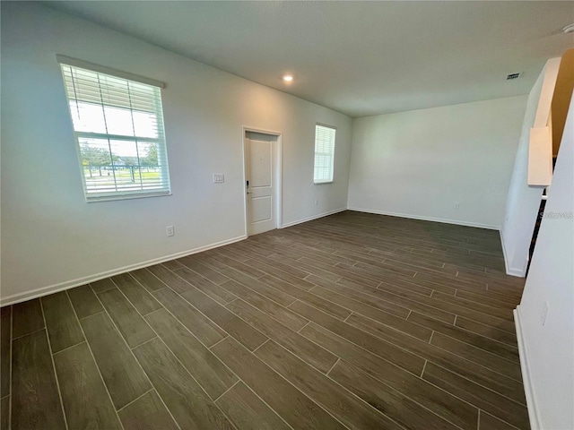 15579 Water Spring Blvd, Winter Garden, FL 34787 - empty room featuring dark wood-style floors and recessed lighting