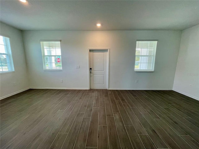 15579 Water Spring Blvd, Winter Garden, FL 34787 - empty room with dark wood-style floors and recessed lighting