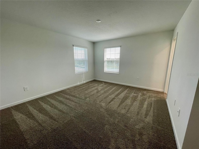 15579 Water Spring Blvd, Winter Garden, FL 34787 - unfurnished room with dark carpet and baseboards