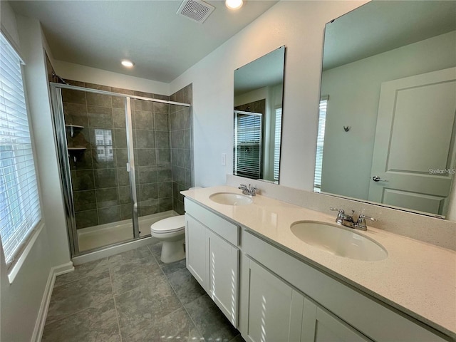 15579 Water Spring Blvd, Winter Garden, FL 34787 - bathroom with double vanity, a stall shower, and recessed lighting