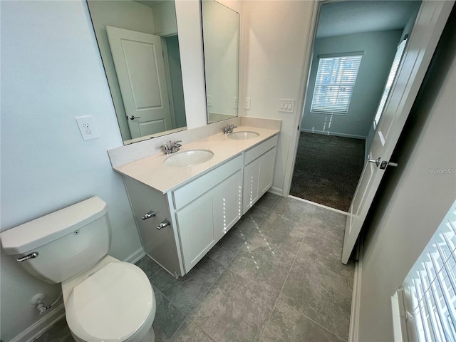 15579 Water Spring Blvd, Winter Garden, FL 34787 - bathroom featuring double vanity and baseboards