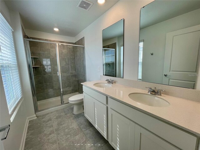 15579 Water Spring Blvd, Winter Garden, FL 34787 - full bathroom with double vanity, a shower stall, and recessed lighting