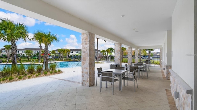 15579 Water Spring Blvd, Winter Garden, FL 34787 - view of patio / terrace with a community pool and outdoor dining space