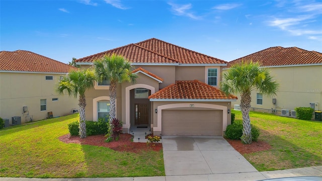 381 Cabello Dr, Davenport, FL 33837 - mediterranean / spanish home featuring a tile roof, a garage, stucco siding, a front yard, and concrete driveway
