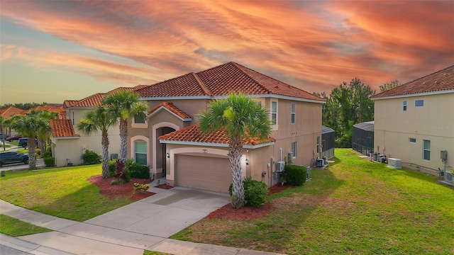 381 Cabello Dr, Davenport, FL 33837 - view of front facade featuring a tiled roof, a garage, stucco siding, a yard, and concrete driveway