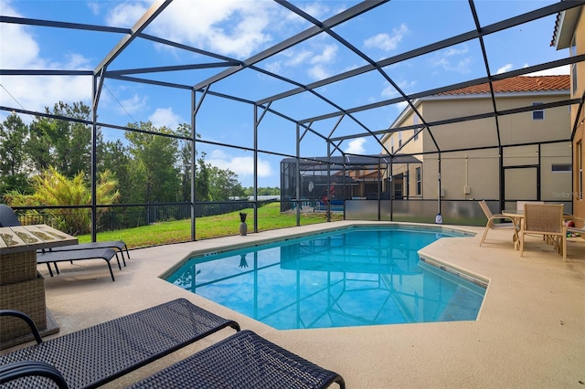 381 Cabello Dr, Davenport, FL 33837 - outdoor pool featuring a patio area, glass enclosure, and a yard