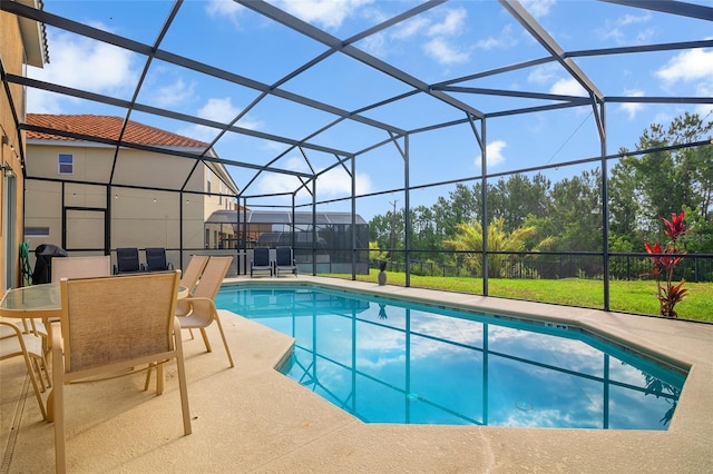 381 Cabello Dr, Davenport, FL 33837 - outdoor pool featuring a patio area and glass enclosure