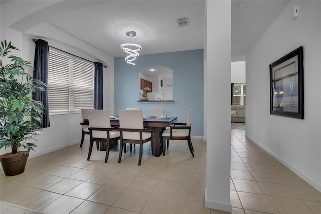 381 Cabello Dr, Davenport, FL 33837 - dining room featuring light tile patterned floors, a chandelier, and baseboards