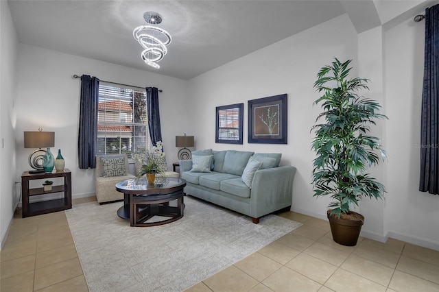 381 Cabello Dr, Davenport, FL 33837 - living room with light tile patterned flooring, a chandelier, and baseboards