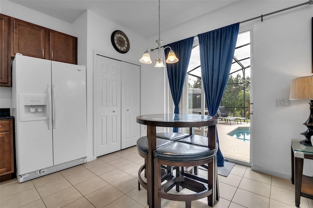 381 Cabello Dr, Davenport, FL 33837 - dining space featuring a chandelier and light tile patterned floors
